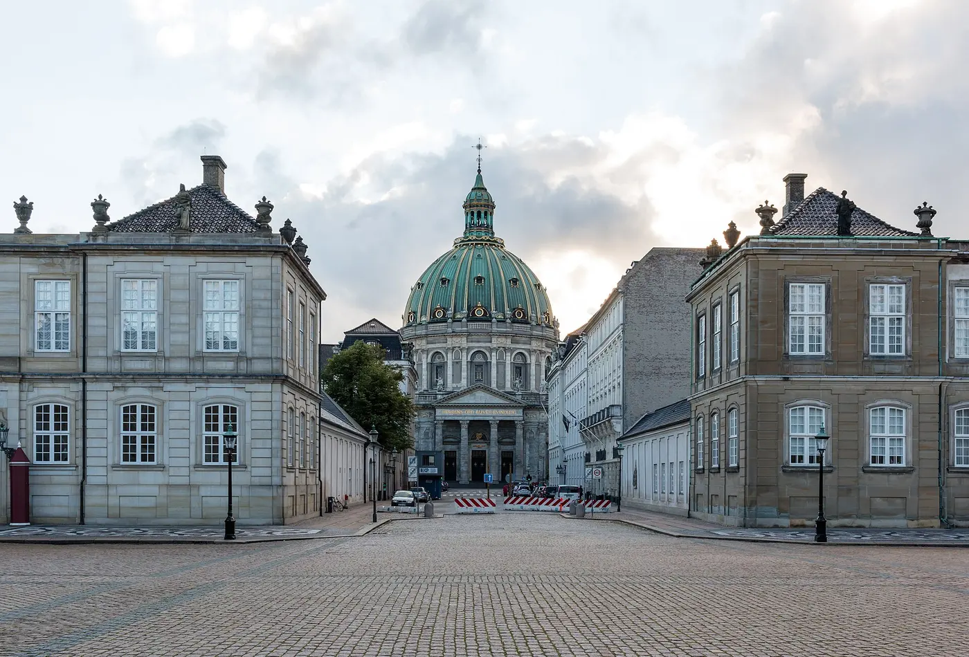 The Marble Church dome seen between the rococo palaces of Amalienborg