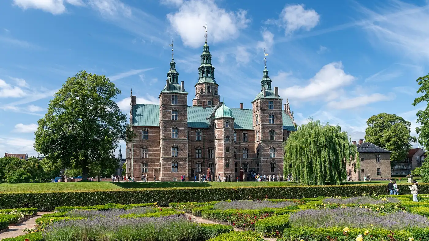 Rosenborg Castle seen from the King's Garden, surrounded by trees and lawns