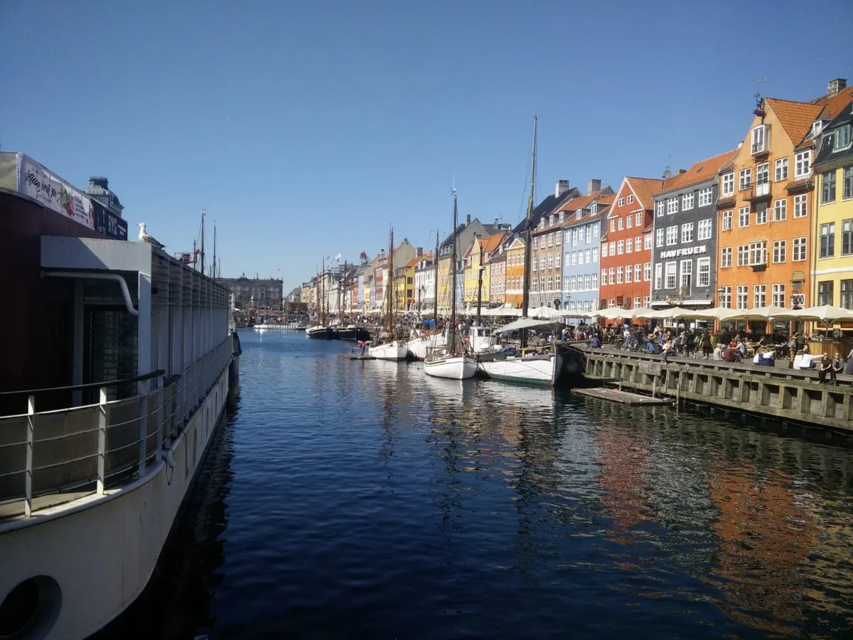 Nyhavn at dusk with evening lights reflecting on the water